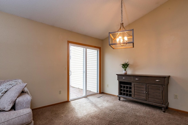 living area with a chandelier, vaulted ceiling, carpet, and baseboards