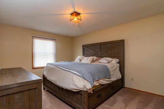 bedroom with baseboards and light colored carpet