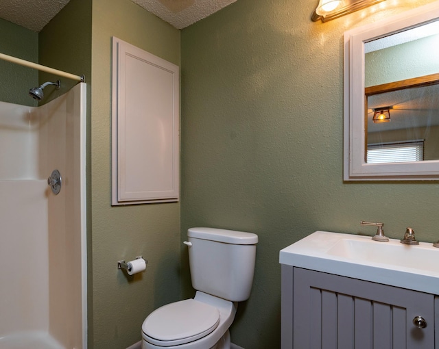 full bathroom with toilet, vanity, a textured ceiling, and a shower