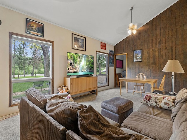 2595 Carver Ave E, Maplewood, MN 55119 - carpeted living area with wooden walls, a ceiling fan, ornamental molding, and vaulted ceiling