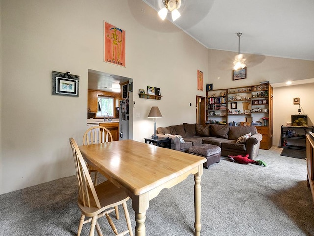 2595 Carver Ave E, Maplewood, MN 55119 - dining area with a ceiling fan, light colored carpet, and high vaulted ceiling