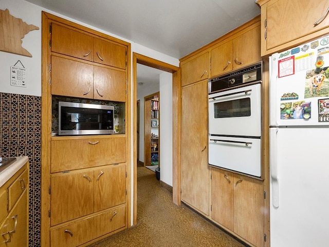 2595 Carver Ave E, Maplewood, MN 55119 - kitchen featuring white appliances, a warming drawer, and brown cabinetry