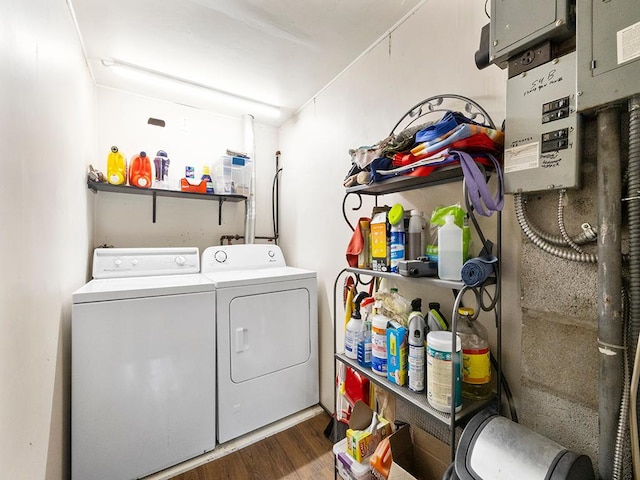 2595 Carver Ave E, Maplewood, MN 55119 - washroom featuring independent washer and dryer and dark wood finished floors