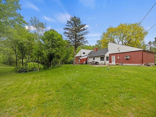 2595 Carver Ave E, Maplewood, MN 55119 - view of grassy yard featuring a patio area