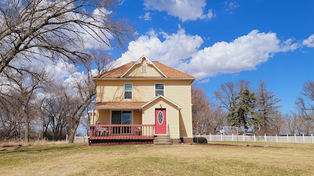 view of front of house featuring a front yard and fence