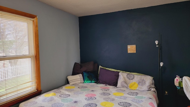 bedroom featuring multiple windows