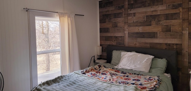bedroom with wooden walls