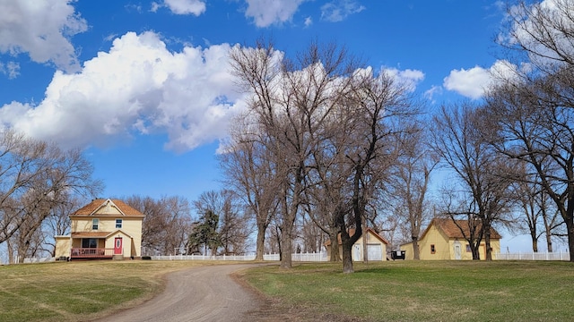 view of road featuring dirt driveway