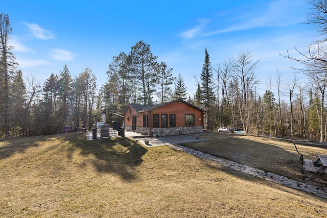45570 Star Lake Rd, Marcell, MN 56657 - view of front of house with log veneer siding and a front yard