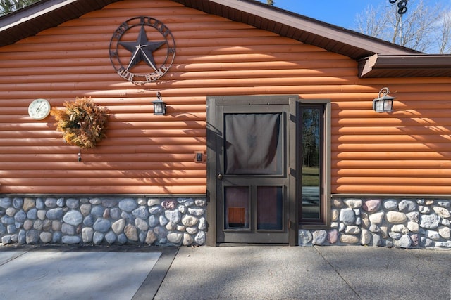 45570 Star Lake Rd, Marcell, MN 56657 - view of exterior entry with stone siding and faux log siding