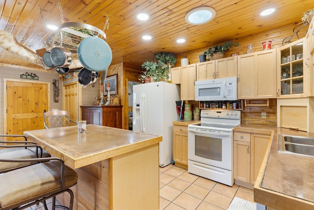 45570 Star Lake Rd, Marcell, MN 56657 - kitchen featuring light tile patterned flooring, white appliances, light countertops, and light brown cabinets
