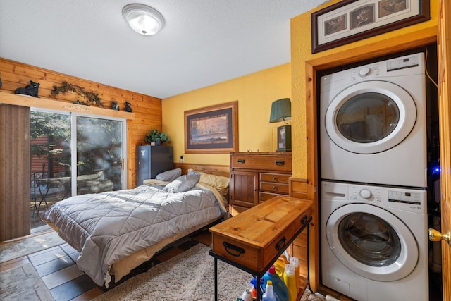45570 Star Lake Rd, Marcell, MN 56657 - interior space with wood walls, access to exterior, and stacked washer and dryer