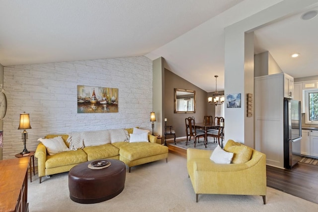 2915 Alvarado Ln N, Plymouth, MN 55447 - living room featuring lofted ceiling, a chandelier, and wood finished floors