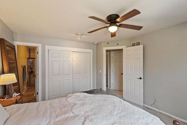 2915 Alvarado Ln N, Plymouth, MN 55447 - carpeted bedroom featuring a closet, baseboards, and ceiling fan