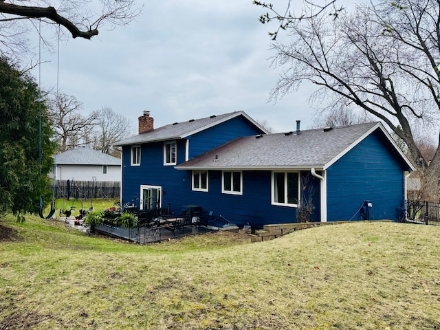2915 Alvarado Ln N, Plymouth, MN 55447 - rear view of house with a chimney, a shingled roof, and a patio area