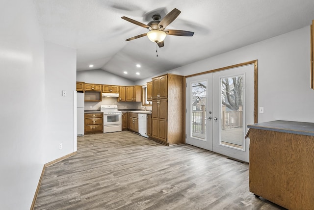 kitchen featuring white appliances, french doors, a ceiling fan, under cabinet range hood, and lofted ceiling