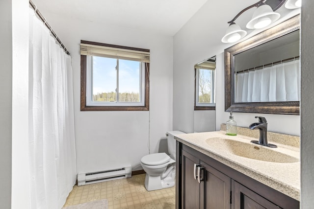 bathroom featuring vanity, toilet, tile patterned floors, and a baseboard radiator