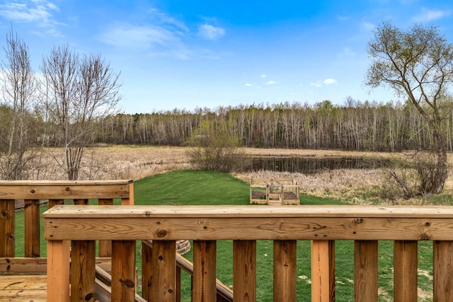 view of yard featuring a water view and a forest view