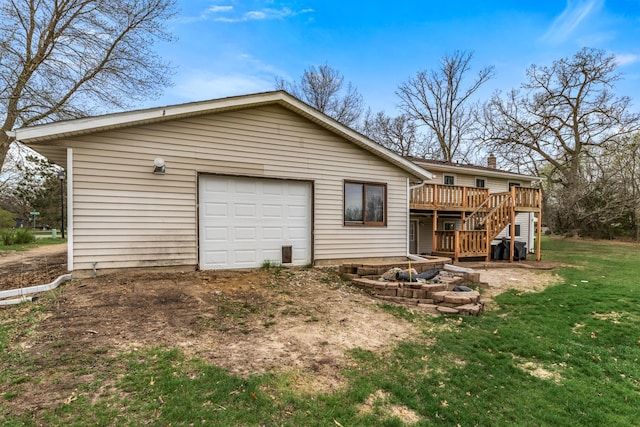 exterior space featuring stairway, a yard, and a wooden deck
