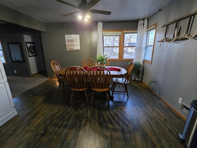 1014 3rd Ave SW, Pipestone, MN 56164 - dining area with visible vents, baseboards, a ceiling fan, and wood finished floors