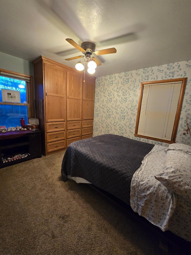 1014 3rd Ave SW, Pipestone, MN 56164 - bedroom featuring carpet flooring, wallpapered walls, and ceiling fan