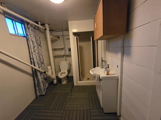 1014 3rd Ave SW, Pipestone, MN 56164 - bathroom featuring tile patterned floors, toilet, a shower stall, and vanity