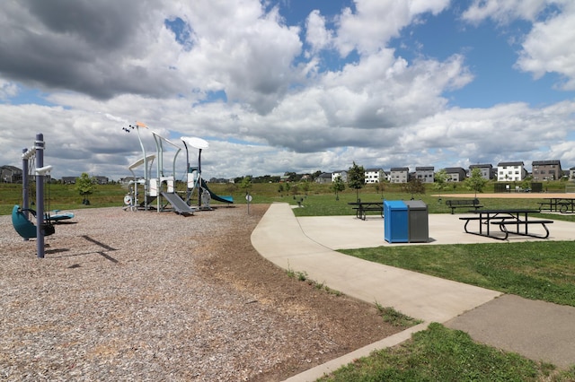 community jungle gym with a lawn