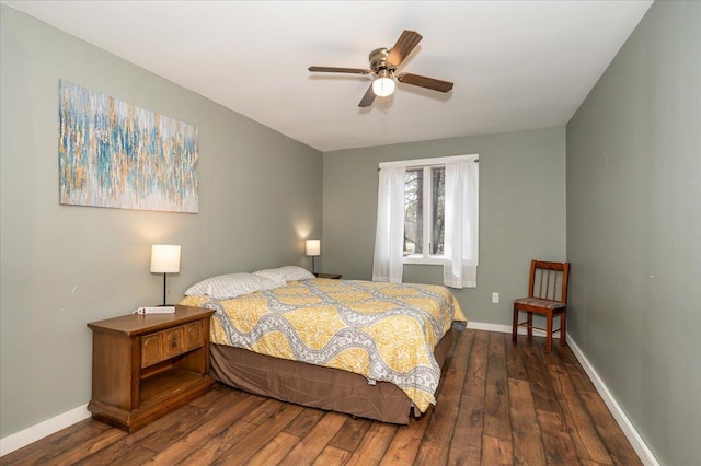 bedroom with ceiling fan, hardwood / wood-style flooring, and baseboards
