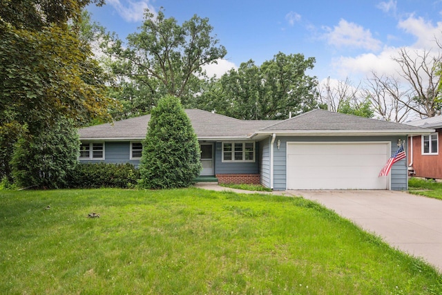9017 31st St, Saint Louis Park, MN 55426 - ranch-style house featuring an attached garage, concrete driveway, and a front yard