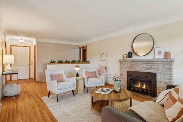 9017 31st St, Saint Louis Park, MN 55426 - living room featuring light wood-style flooring, a fireplace, and ornamental molding
