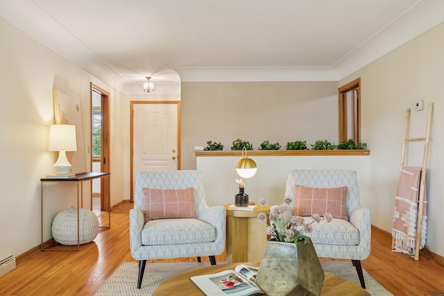 9017 31st St, Saint Louis Park, MN 55426 - sitting room with wood finished floors and a baseboard heating unit