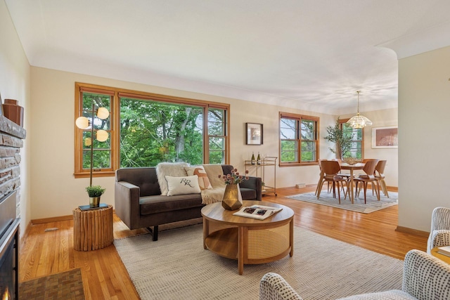 9017 31st St, Saint Louis Park, MN 55426 - living area featuring a stone fireplace and wood finished floors