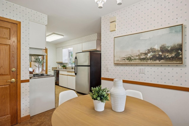 9017 31st St, Saint Louis Park, MN 55426 - dining space featuring wallpapered walls and light tile patterned floors