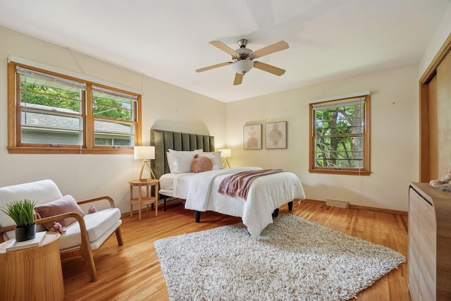 9017 31st St, Saint Louis Park, MN 55426 - bedroom featuring light wood finished floors, ceiling fan, and a closet