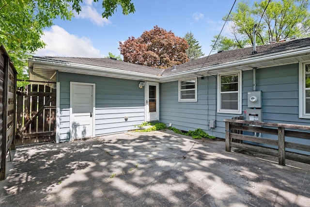 9017 31st St, Saint Louis Park, MN 55426 - rear view of house featuring a patio area and roof with shingles