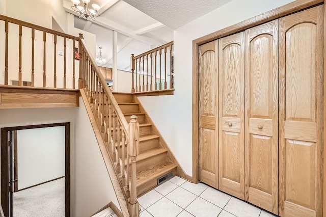 211 Mckinley St, Anoka, MN 55303 - stairs with a chandelier and tile patterned floors