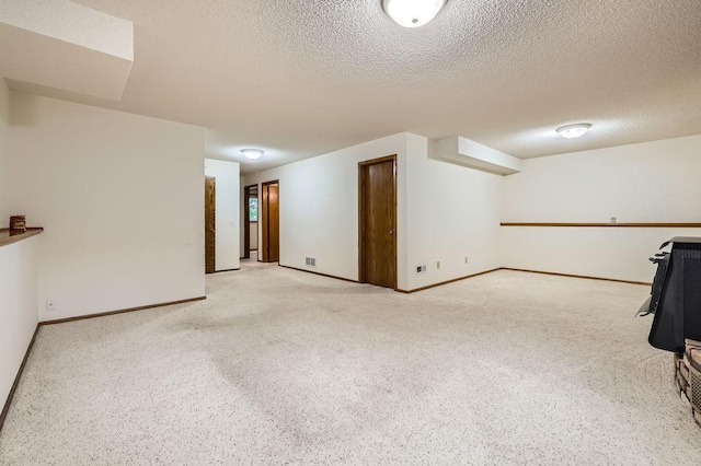 211 Mckinley St, Anoka, MN 55303 - finished basement with a textured ceiling and baseboards