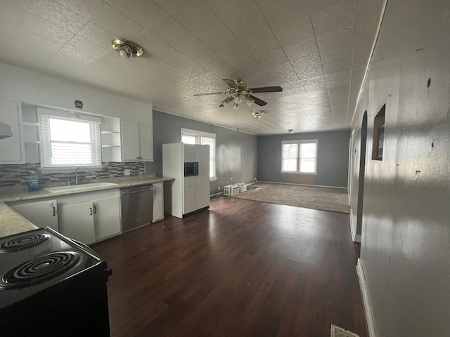 kitchen featuring open shelves, dishwasher, light countertops, a sink, and black range with electric stovetop