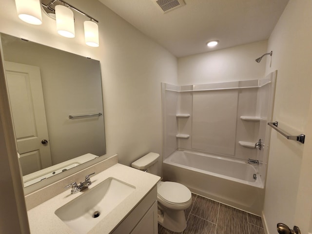 bathroom featuring vanity,  shower combination, visible vents, and toilet