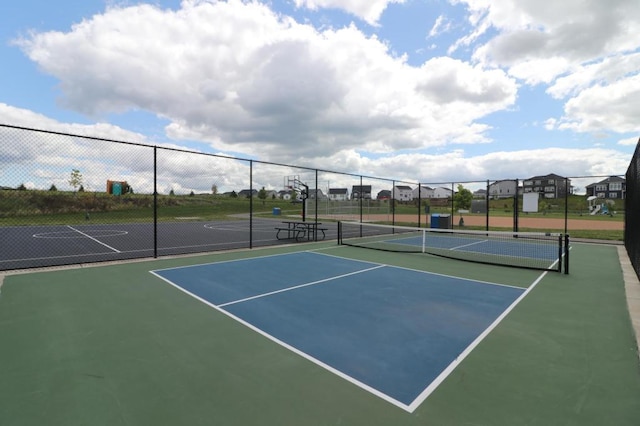 view of sport court with fence and community basketball court