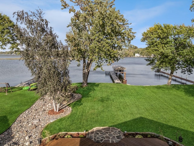 1867 Beach Dr SE, Forest Lake, MN 55025 - view of grassy yard featuring a water view and a dock