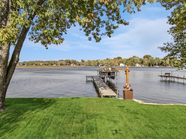 1867 Beach Dr SE, Forest Lake, MN 55025 - dock area with a water view, a yard, and boat lift