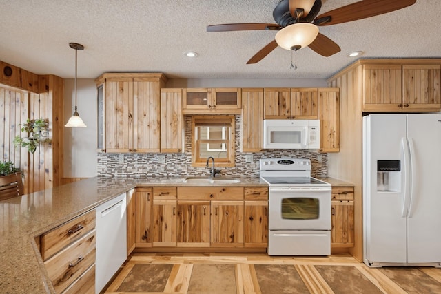 1867 Beach Dr SE, Forest Lake, MN 55025 - kitchen featuring white appliances, a sink, tasteful backsplash, ceiling fan, and a textured ceiling