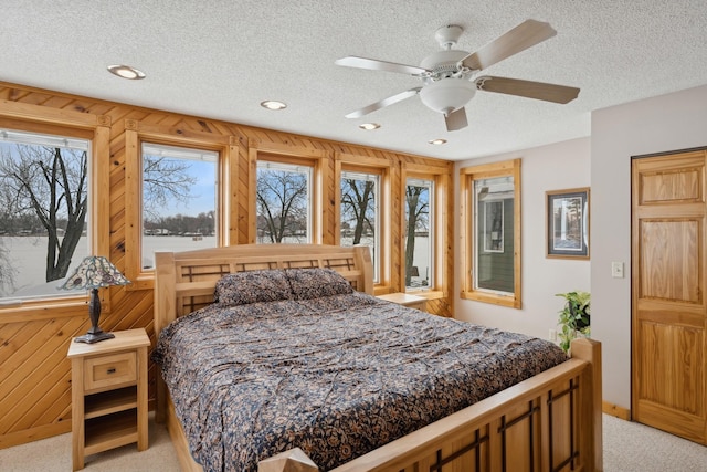1867 Beach Dr SE, Forest Lake, MN 55025 - bedroom with light carpet, multiple windows, a textured ceiling, recessed lighting, and ceiling fan