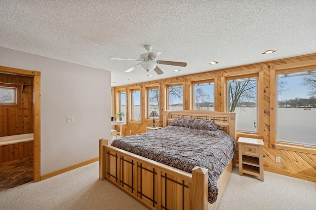 1867 Beach Dr SE, Forest Lake, MN 55025 - bedroom with light carpet, multiple windows, baseboards, recessed lighting, and a textured ceiling