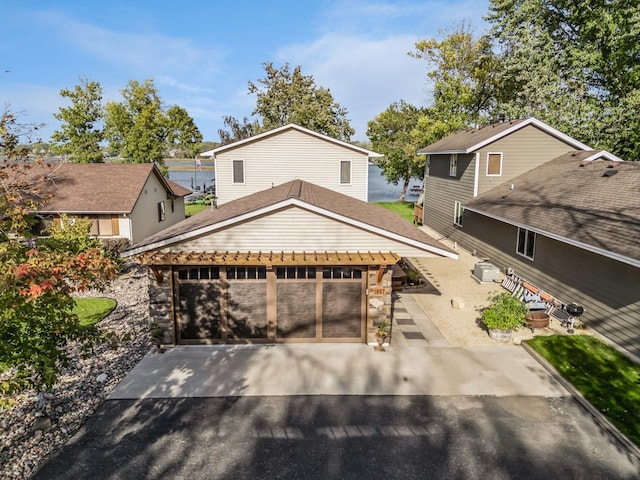 1867 Beach Dr SE, Forest Lake, MN 55025 - view of front of home with driveway and stone siding