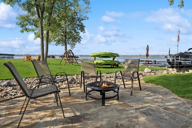 1867 Beach Dr SE, Forest Lake, MN 55025 - view of patio with an outdoor fire pit and a water view