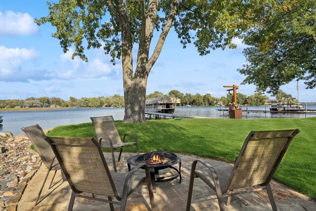 1867 Beach Dr SE, Forest Lake, MN 55025 - view of patio with an outdoor fire pit and a water view