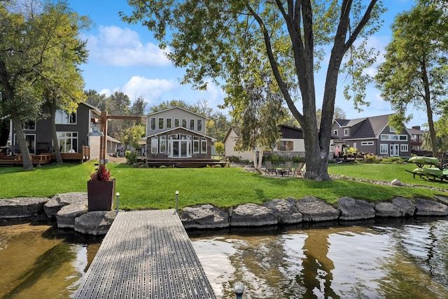 1867 Beach Dr SE, Forest Lake, MN 55025 - dock area featuring a yard and a deck with water view