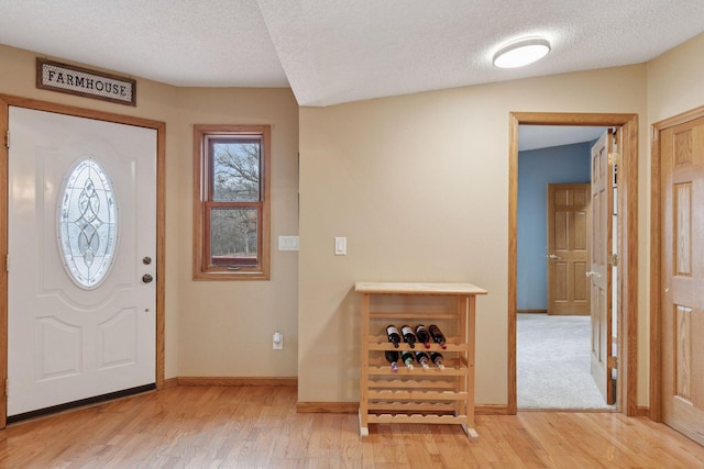 34115 Malmberg Ave, Chisago Lake Twp, MN 55045 - entrance foyer featuring light wood-style flooring and a textured ceiling